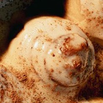 Attempt three: an iced roll, cinnamon heavier at the edge.