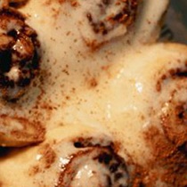 Attempt six: an iced roll, glaze running between it and the next.